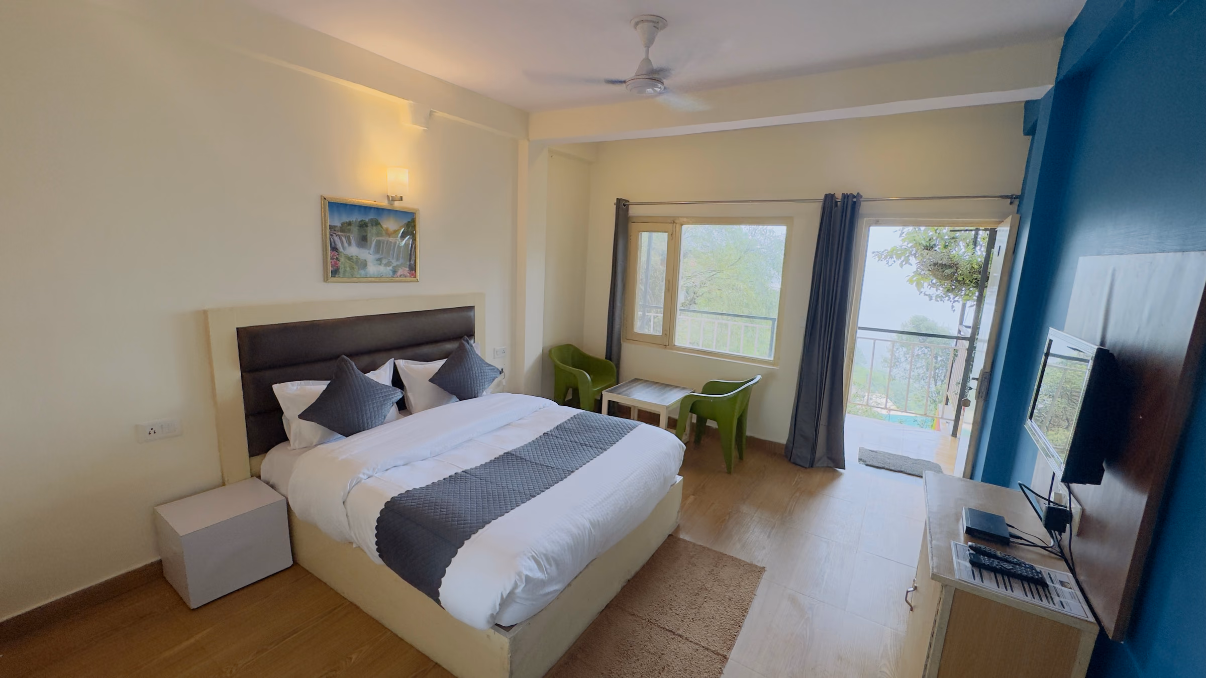 Deluxe room 205 with the window and seating chairs