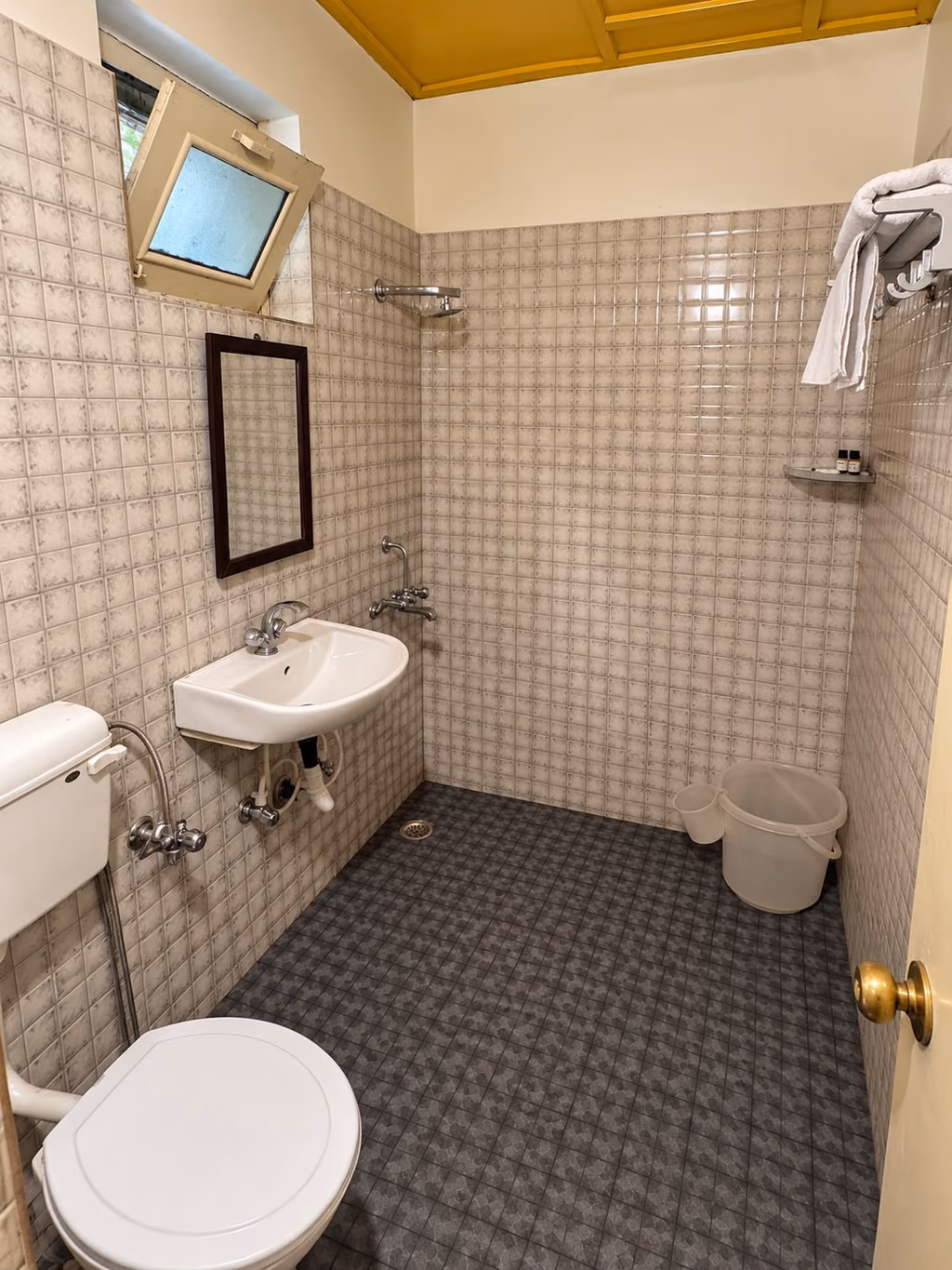 Attached bathroom with geyser in a Luxury King room